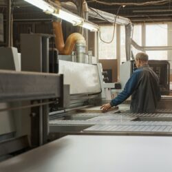 Competent craftsman working in modern furniture manufacture